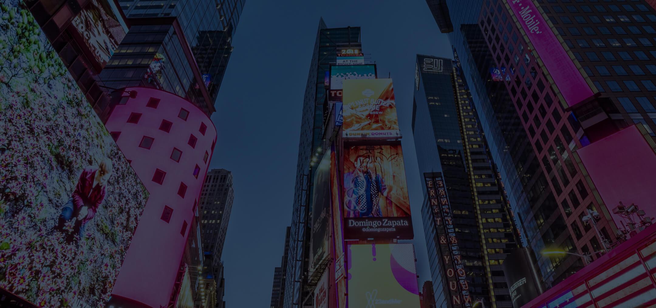 View of buildings with large advertising screens